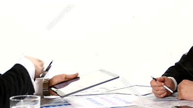 Businessmen discussing charts on the tablet