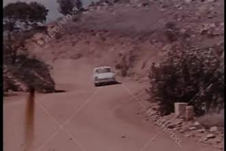 Car chase on dirt road