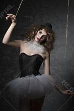 Woman like gothic puppet clown