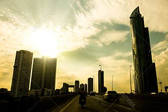 silhouettes city building with sun burst and blue sky,city skyscraper