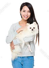 Asian woman with her pomeranian dog