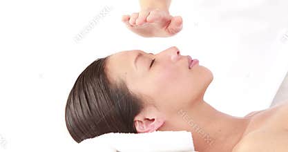 Woman enjoying a reiki treatment