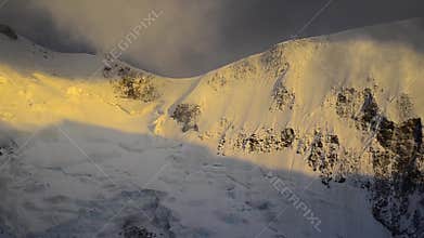Strong wind and dark clouds over Mont Blanc peak. France