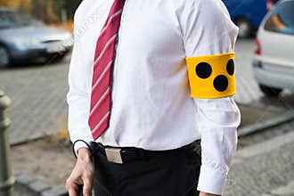 Blind person wearing armband