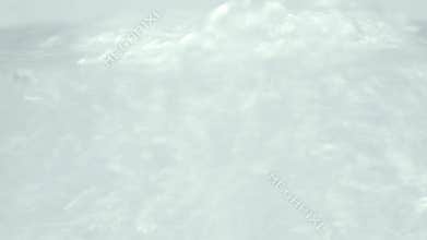 Water pouring into glass.