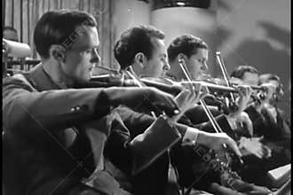 Violinists playing in orchestra