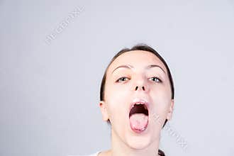 Woman with Wide Open Mouth Looking at Camera