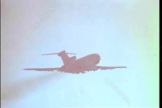 Airplane flying toward the sun