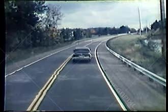 Car driving down country road