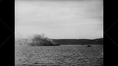 Soldiers firing weapons from battleship, World War II