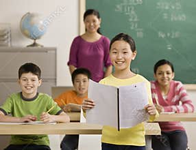 Girl reading report to classmates