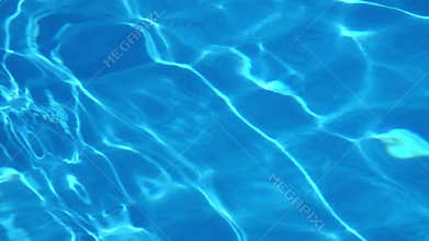 Pool water surface glimmering on sun