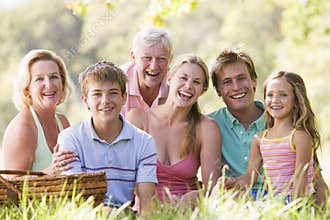 Family at a picnic smiling