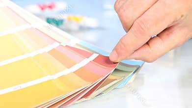 Choice from palette color scale, hand pointing