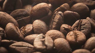 A pile of roasted coffee beans rotating