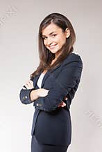 Young happy business woman with cross hands.