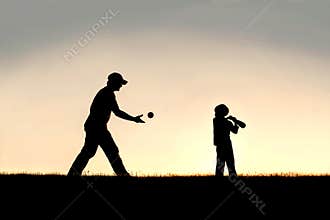 Silhouette of Father and Young Child Playing Baseball OUtside