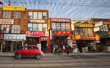 Chinatown in Toronto (Canada) and old vintage red Italian Car