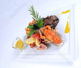 Plate of fine dining meal beef with lobster