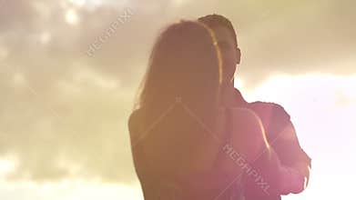 Romantic young couple in love swing each other around in loving relationship