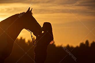Silhouette of Girl Kissing Horse