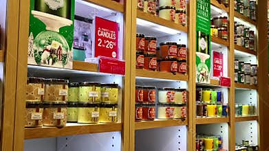 Motion of scent candle on display shelf