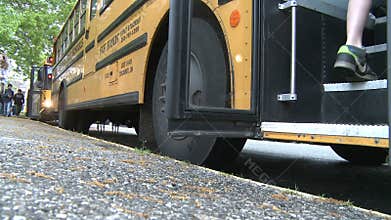 Students getting on bus. (3 of 3)