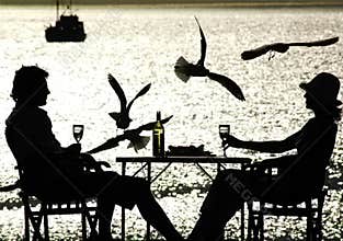 Couple having a meal by the sea