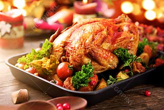 Roasted turkey garnished with potato. Thanksgiving or Christmas dinner