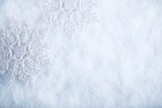 Two beautiful sparkling vintage snowflakes on a white frost snow background. Winter and Christmas concept