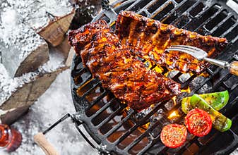 Spare ribs grilling over a winter BBQ