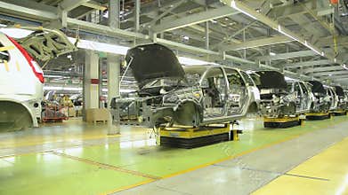 People work at assembly of cars Lada Kalina on conveyor of factory AutoVAZ, on September 30, 2011 in Togliatti