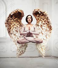 Young woman yoga levitation and meditation concept. Objects flying in room.