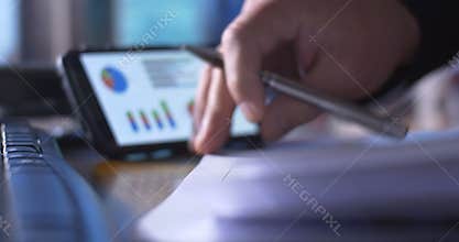 Accounting occupation working on tax return forms at desk on calculator