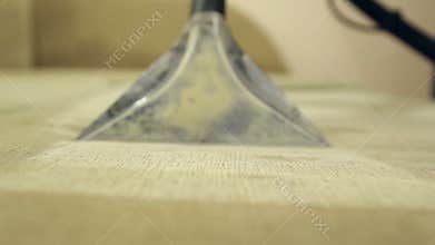Service cleaning dirty sofa and chairs with special tool