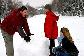 Family Making Snowman