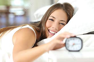 Happy woman waking up having a good day