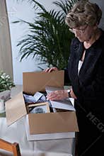 Bereaved female sorting things