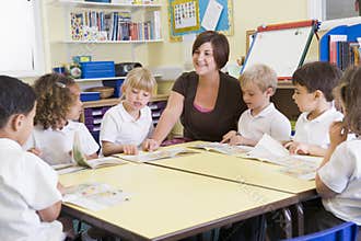 Schoolchildren and their teacher in class