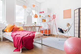 Girl relaxing in her bedroom