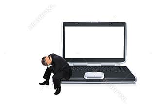 Stressed businessman on laptop