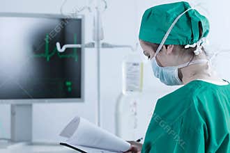 Medic standing with medical documentation