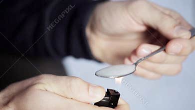 Addict preparing dose of crack cocaine drug 48