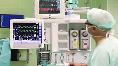 Doctor is checking actual state on monitor II