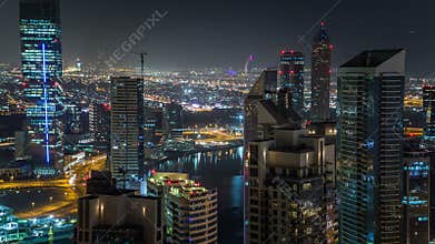 Scenic aerial view of a big modern city at night timelapse. Business bay, Dubai, United Arab Emirates.
