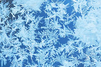 Winter ice frost, frozen background. frosted window glass texture. Cold cool icicles background. Winter wonderland scene.