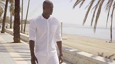 Handsome muscular African man on the seafront