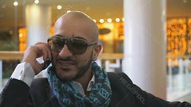 Arab businessman talking on mobile phone