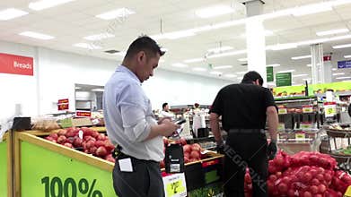 Worker putting onion on sale area