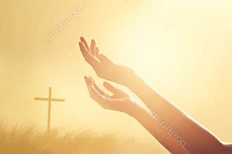 Respect and pray on the cross and nature sunset background